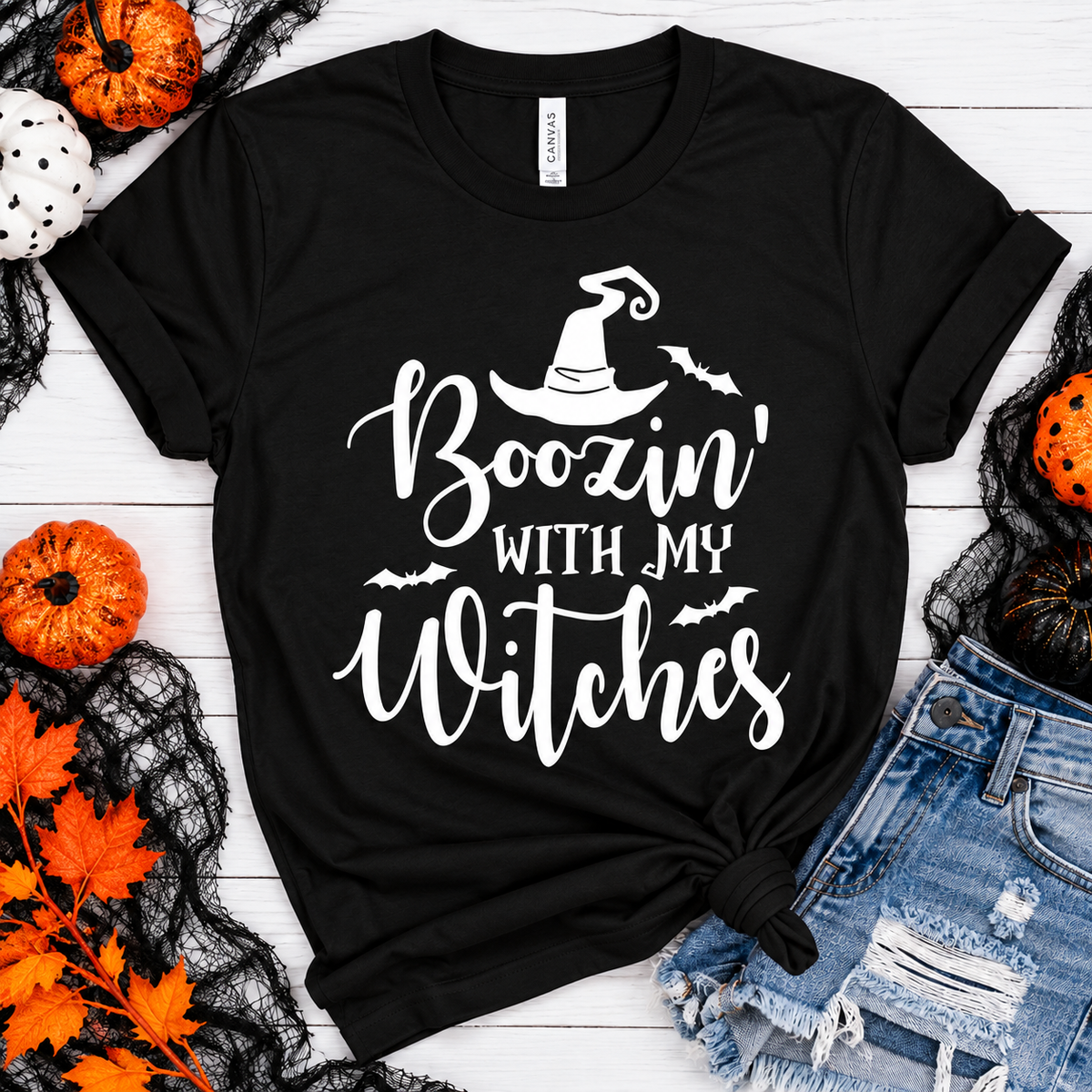 Black t-shirt with "Boozin' With My Witches" text and witch hat design.