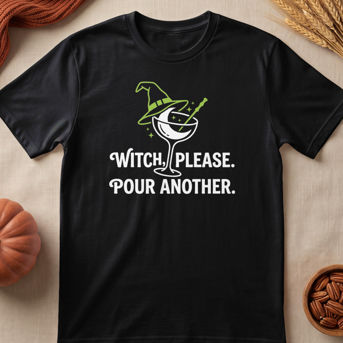 Black t-shirt with a witch hat, martini glass, and "Witch, Please. Pour Another." text.