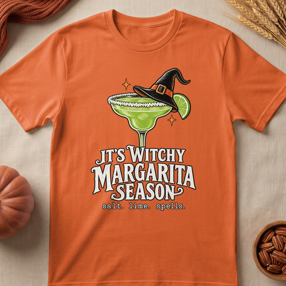 Orange t-shirt with "IT'S WITCHY MARGARITA SEASON" and spooky margarita graphic.