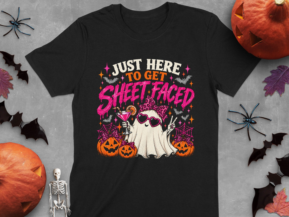 Black t-shirt with ghost graphic saying "Just Here To Get Sheet Faced" for Halloween.
