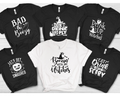 Halloween graphic t-shirts with phrases like "Bad & Boozy" and "Boozin' with My Witches."