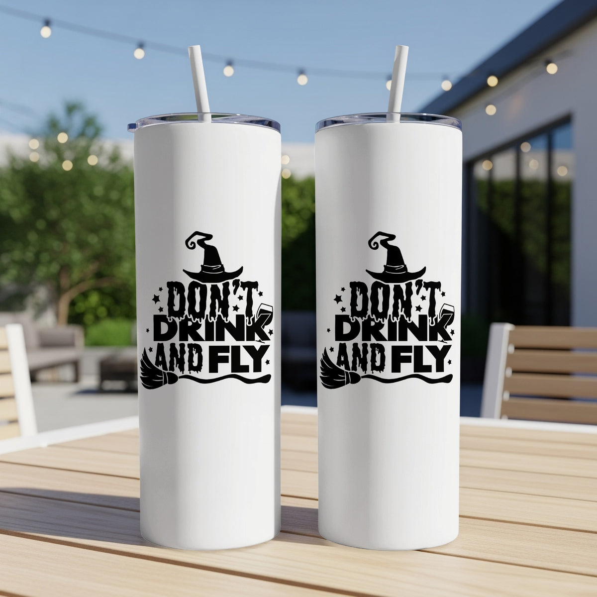 Two white tumblers with black Halloween witch hat and broom design saying "Don't Drink and Fly".