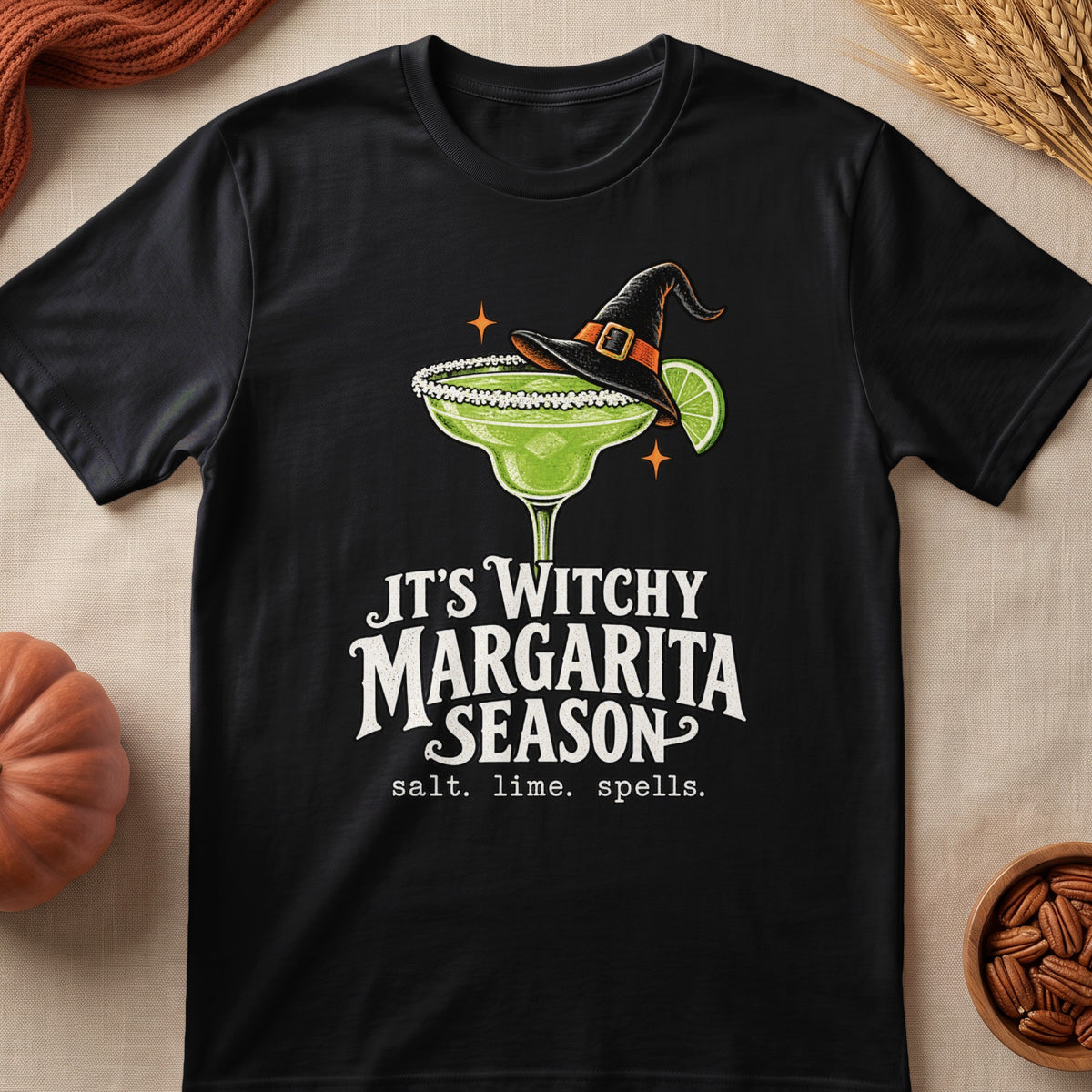 Black t-shirt with a witch hat margarita graphic and text "It's Witchy Margarita Season."