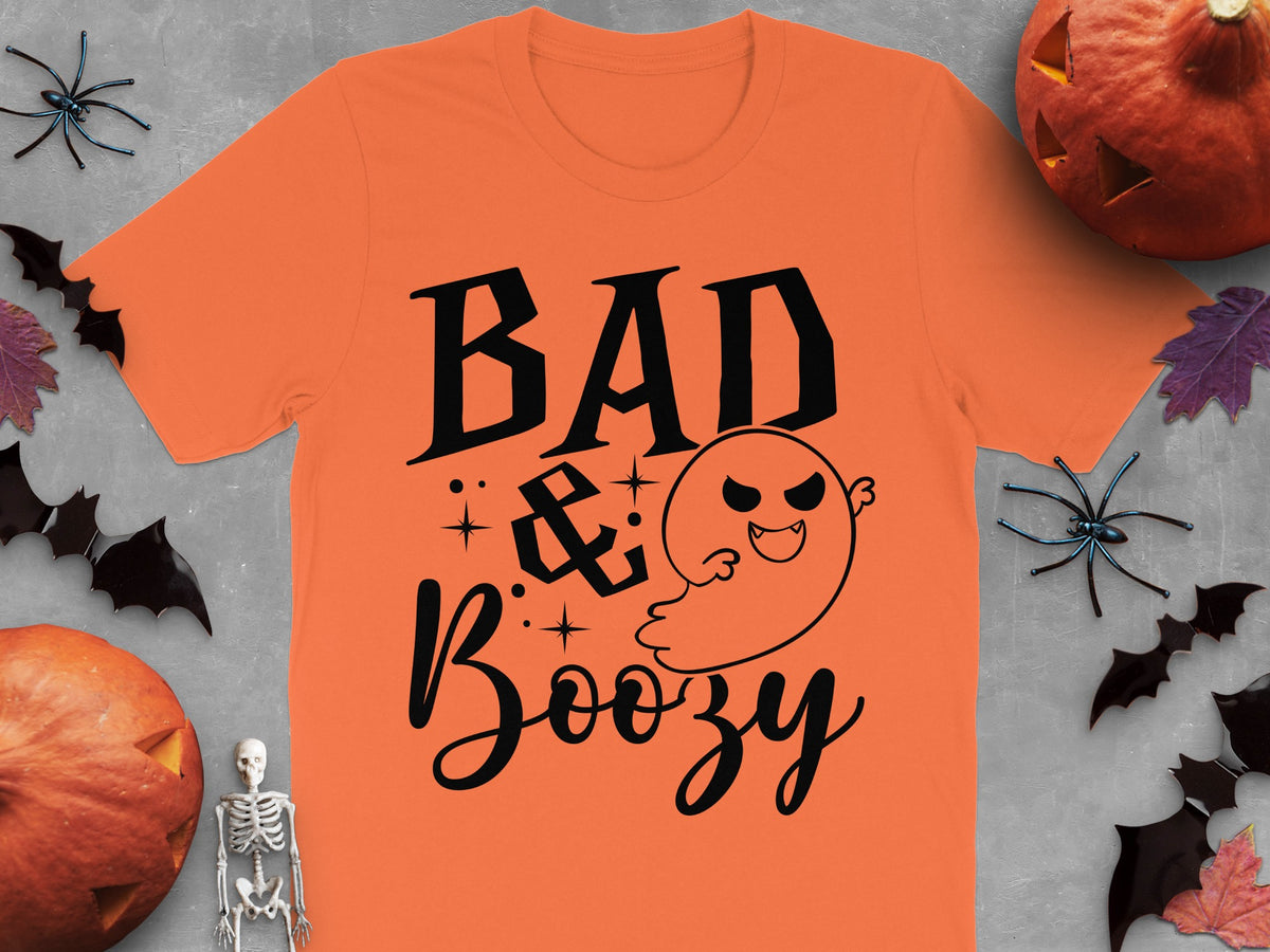 Orange t-shirt with black "BAD & Boozy" text and a ghost graphic.